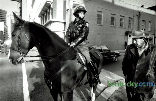 Officer Karen Love, on Red, talked with Harlan McQuinn in downtown Lexington on December 29, 1986. Love, then 30, went on the job that week as the first female member of the Lexington Mounted Patrol. You can see a story, photos and video on Lexington Police Deparment's Mounted Unit in today's Herald-Leader and on Kentucky.com. Photo by David Perry | Staff