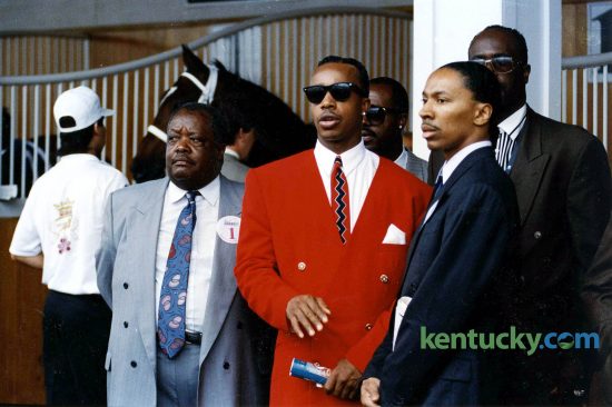 Rapper M.C. Hammer, center, surrounded by family in the paddock just before the 1992 Kentucky Derby. In the background is Hammer’s horse, Dance Floor, who finished third in the Run for the Roses. Hammer rose to fame in 1990 with his song “U Can’t Touch This.” Photo by Charles Bertram | staff