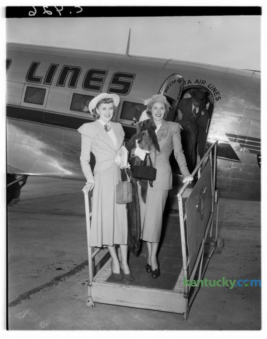 Marie "The Body" McDonald, right,  posed with Mrs. Danny Bordett, upon her arrival in Lexington's Blue Grass Field in April 1948. She was enroute to visit relatives in Burgin, Ky., her home town.  McDonald was born Cora Marie Frye,  and after her parents divorce she moved with her mother and stepfather to Yonkers, New York. At the age of 15, she began competing in numerous beauty pageants and was named "The Queen of Coney Island", "Miss Yonkers" and "Miss Loew's Paradise". At the age of 15, she dropped out of school and began modeling. In 1939, McDonald was named "Miss New York State". She landed a showgirl role on Broadway at age 17 and shortly thereafter moved to Hollywood. She appeared in films and on stage until her death in 1965. Published in the Lexington Leader April 27, 1948. Herald-Leader Archive Photo