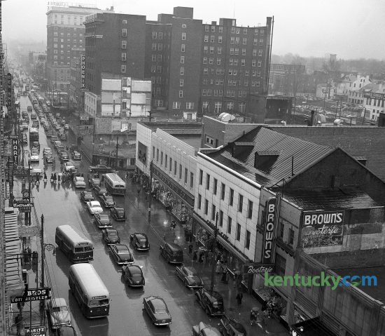 Hundreds of out-of-town automobiles added to the difficulty of a typical downtown Lexington traffic jam March 17, 1951. Thousands of loyal fans of teams in the 34th annual state high school basketball tournament flocked to the city for the semi-finals and finals being held at Memorial Coliseum. Clark County won the tournament defeating Cuba 69-44. The photo was taken from the First National Bank Building, with a view toward the east including the busy Main and Limestone intersection. Herald-Leader Archive Photo