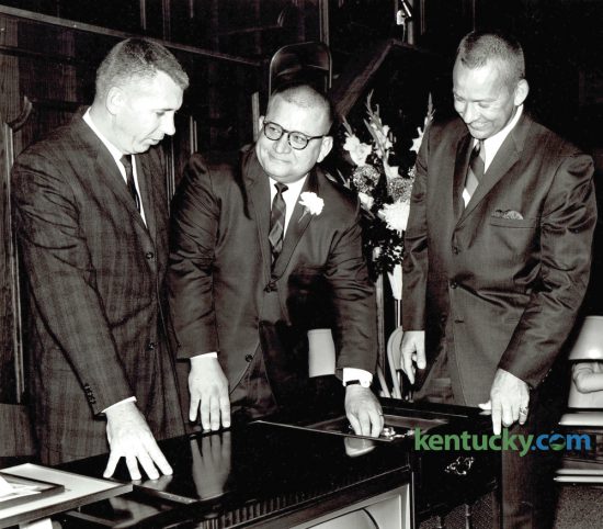Edward Cruze, chairman of Southland Christian Church board, left, Rev. Wayne B. Smith and Rev. Jack Ballard, guest speaker from Decatur, Ga., looked over a surprise gift, a combination television, radio and record-player set, during dedication ceremonies for the church's new location on Hill 'n Dale Road, on November 8, 1964. Rev. Wayne Smith, 87, who for four decades led what is now Lexington's largest congregation died peacefully Tuesday night. Herald-Leader Archive Photo