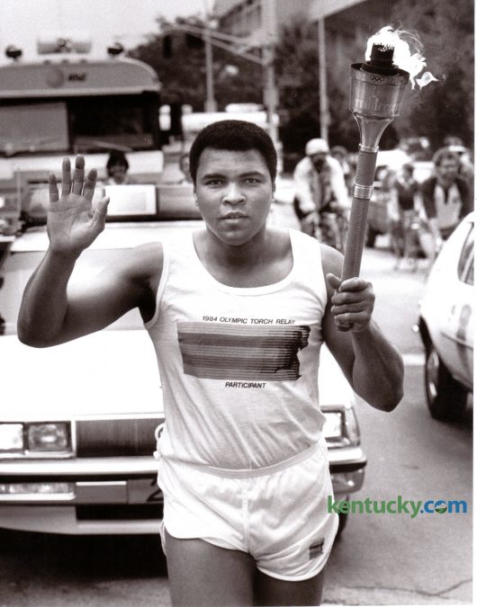 Former heavyweight boxing champion Muhammad Ali took part in the 1984 Olympic Torch Relay through downtown Louisville May 27, 1984. Photo by Ron Garrison | Staff