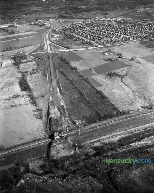 Construction of New Circle Road at the intersection of Leestown Road, November 1960. Town Branch runs along the bottom of the photo and the Meadowthorpe neighborhood is seen at the top right. The area in the middle on the right side is now a number of hotels, stores townhomes and restaurants such as Applebee's, Zaxby's and Taco Bell. Further to the right of that is the Meadowthorpe Shopping Center which includes a Kroger grocery store. On the far left in the middle, is what us now Leestown Middle School. Herald-Leader Archive Photo