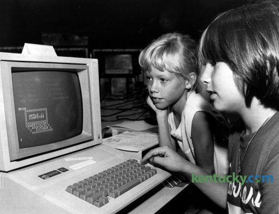 Nine-year-old Lisa Sherrod, left, and 11-year-old Kirby Varney work on an Apple IIe computer during a summer computer camp at Shearer Elementary School in Winchester, July 16, 1985. During the camp, students got lessons in computer history, computer literacy and typing skills and how to create and save programs. After the technical things were learned, the students turned to more fun things. They drew pictures on the computer screens. Some were very simple, such as an American flag or a computer, but others were more detailed, such as a picture of Jetfire, one of the Transformer toys. Photo by John C. Wyatt | staff