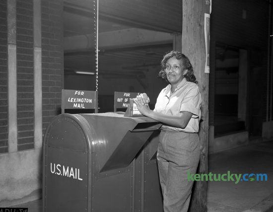Ruby Flynn, 412 Price Road, was named substitute city letter carrier for the Lexington Post Office becoming the city's first peace time woman mail carrier in October 1963. Postmaster William Cecil said that all carriers begin as substitutes and generally serve on different routes before being assigned to a regular one. Mrs. Flynn, mother of six children, did civilian work with the Navy Department during World War II. Published in the Lexington Leader October 3, 1963.