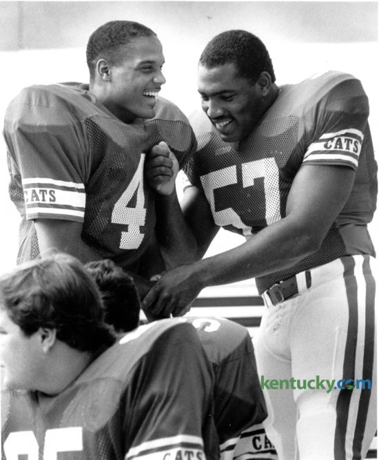 University of Kentucky football players Cornell Burbage, left and Dermontti Dawson joke around as they gathered for a team photo on picture day August 19, 1985. Kentucky finished the 1985 season with five wins and six losses under coach Jerry Claiborne. The 2016 Wildcats hold their media day today at Commonwealth Stadium. Photo by David Perry | Staff