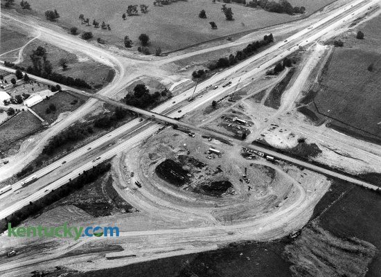 Construction of the Man o' War Boulevard interchange with Interstate 75, June 17, 1988. I-75 runs towards the top right of the picture while what would be come Man o' War Boulevard comes into the frame from the upper left corner. Man o' War replaced Bryant Road, which shown here going over the interstate, was torn down in October 1988. Today a portion of Bryant Road exist to the west of I-75. Six months later, this last part of the Man o' War project was completed with little fanfare. Man o' War had been listed on city plans since the 1930s, but for many years, it was to be called Tiverton Way. The Urban County Council decided in 1974 that it would be named Man o' War Boulevard, after the famous race horse who never raced in Kentucky but retired to stud here. The road was completed and widened in segments over the years. The first section of road -- between Richmond Road and Palumbo Drive -- was opened in 1975. A second section opened four years later, a third four years after that. Man o' War was built by the state. It was planned, designed and will be maintained by Lexington. The state paid $37.6 million of the cost. The city paid $11 million. Along with the new I-75 interchange was a new sign on the interstate that said "Man o' War," but the sign didn't indicate that the road went to Lexington. Man o' War as since been been further extended to the east, ending at Winchester Road.  Photo by Charles Bertram | staff