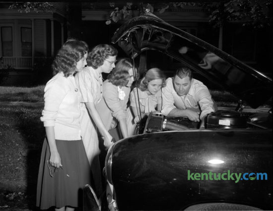 Lexington patrolman William Sellers gave some Henry Clay High School students pointers in preparation for a driving class, September, 1948. The classes were sponsored by the Bluegrass Automobile Association and the Lexington police department. From left are Bobby Cain, Pearl Woolery, Betty Smith Jo Ann Robinson and partolman Sellers. About 40 students took the course. Published in the Lexington Leader September 17, 1948. Herald-Leader Archive Photo