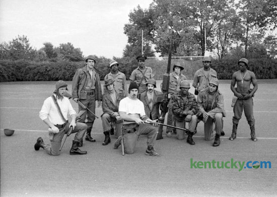 The defensive unit of the 1975 University of Kentucky football team called themselves The Dirty Dozen, in reference to a movie about a daring raid behind enemy lines in World War II, staring Lee Marvin and former Cleveland Browns great Jim Brown. In early October the unit, then ranked number 8 in the nation defensively, decided to pose for a photo in military gear, with the help of J&H Army Surplus. Front row kneeling, from left, Rick Fromm, Bob Winkel, Mike Emanuel, Tom Ranieri, Jerry Blanton, Art Still. Standing, from left, Jim Kovach, Ray Carr, Tony Gray, Mike Siganos, Terry Haynes, Greg Woods. Photo by David Perry | Staff