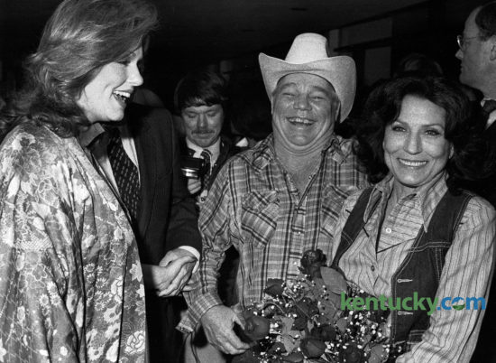 Kentucky first lady Phyllis George Brown with Mooney and Loretta Lynn at the Kentucky premiere of the movie Coal Miner's Daughter in Louisville March 5, 1980. The film was based on a book by Miss Lynn, describing how she emerged from poverty in the coalfields of Eastern Kentucky to become one of country music's top stars. Actress Sissy Spacek played Loretta, a role that earned her the Academy Award for Best Actress. Photo by David Perry | Staff