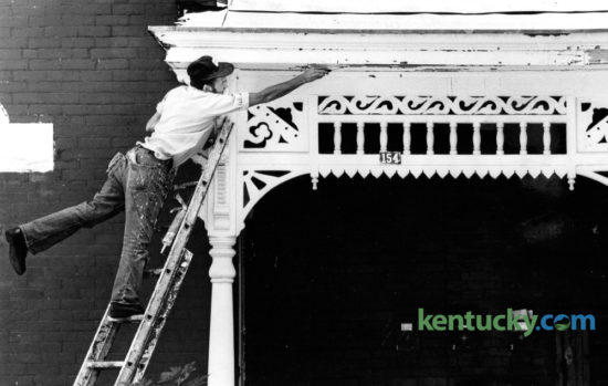 Cloyd Standafer, with C&S Painting, scraped loose paint from the porch of a house at 154 Kentucky Avenue on September 29, 1980. Photo by Charles Bertram | Staff