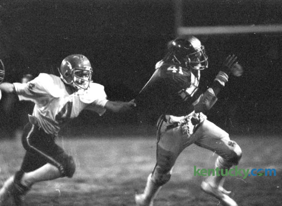 Henry Clay's Robert Wakefield, right, tried to elude the grasp of Lafayette defender Paul Vines in their game October 30, 1981 at Henry Clay. The Blue Devils won 31-6 and went on to claim the school's only state football title that year. This years squard takes on No. 7 Lafayette tonight. Photo by Charles Bertram | Staff
