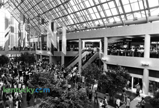 The atrium of Louisville's Galleria, opening day, Sept. 29, 1982. The $130 million development included more than 1.4 million square feet of office space, anchored by two 27-story glass and steel office buildings containing 415,000 square feet each. A three-level retail mall will 339,000 square feet was located between the towers. The development covered much of the two square blocks downtown bounded by Fourth Avenue, Liberty Street, Fifth Street and Muhammad Ali Boulevard. It was built on the site of the River City Mall, which opened in 1973. On this day When the Galleria opened, about 75 percent of the retail space had been leased. In 2004, the retail part of the development went through a $75 million renovation featuring a collection of bars, restaurants and stores now called Fourth Street Live. Photo by Charles Bertram | staff
