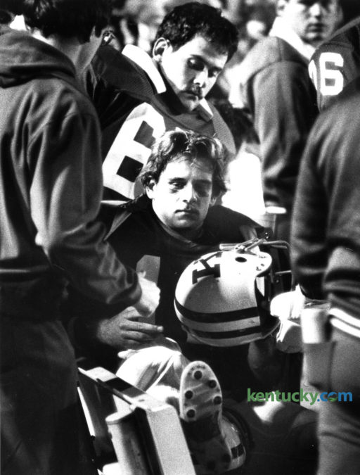 UK quarterback Doug Martin sat on the UK bench after injuring his knee in a 34-10 loss to LSU, Oct. 16, 1982.