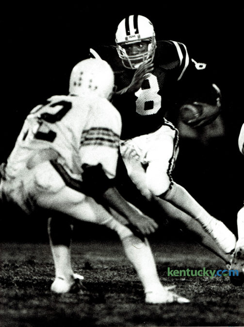 Tates Creek quarterback Ron Mack looked for running room against the Cawood Trojans on September 16, 1983. The Commodores pulled out the victory driving 77 yards in 14 plays as Mack ran the ball in from the 7 yard line with 48 seconds remaining. The Commodores take on Madison Southern tonight at home. Photo by Ron Garrison | Staff