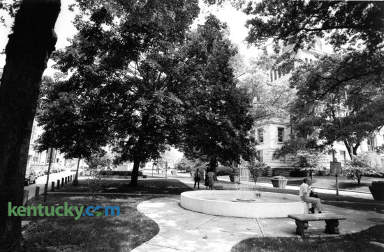 Cheapside Park on Main Street in Lexington, Aug. 24, 1989. The Fayette County Courthouse is visible through the trees, just over the fountain. The name Cheapside was taken from the historic marketplace in London, England. As a maketplace during the slavery era, Cheapside became the largest slave market in the South. After the war it was a public square and market, hosting Court Days for public trading until 1921. The popular downtown free concert series, Thursday Night Live, started here in 1994 and in 2010 a permanent facility for the Farmers Market opened on the site with the unveiling of the Fifth Third Bank Pavilion. The glass pavilion covers about 5,700 square feet that can accommodate approximately 28 stands on market day. On the far left of the picture, you can see the Cheapside, a one-way, one-block street between West Short and West Main streets. In late 2008, the Urban County Council approved the permanent closure of Cheapside to vehicular traffic. Photo by Clay Owen | staff
