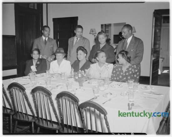 Section chairmen and team captains of the colored solicitation division of the Community Chest campaign met at the Phyllis Wheatley YWCA to work out details of the drive, which extends from October 27 to November 7, 1947. Pictured left to right at the luncheon meeting are, first row, Mrs. Lucy Hart Smith, chairman, special gifts committee; Mrs. Lydia Searcy, captain, Coletown; Ethel Taylor, co-chairman; Mrs. Shirley Hardy, captain, West End; Mrs. Lizzie Johnson, YWCA executive; standing, U.S. Fowler, division chairman; A.R. Howard, captain central district; Mrs. Elizabeth Moody, assistant captain, and Clifton Coleman, captain, South End. Published in the Lexington Herald-Leader October 26, 1947. Herald-Leader Archive Photo