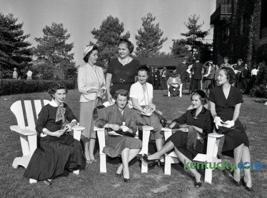 Ladies enjoying the clubhouse lawn at Keeneland Race Course in October 1954 included, seated from left to right, Mrs. William Carl, Mrs. W.T. Bishop, Mrs. Charles Rhodes, Mrs. Harry Scott Jr. and Mrs. Richard Arnspiger. Being them were Mrs. Warren Wright Jr. and Mrs. Jack Wilkinson.       Herald-Leader Archive Photo