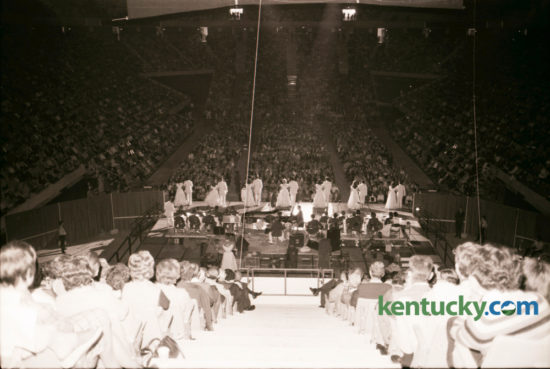 The first concert in Rupp Arena featured Lawrence Welk and his orchestra and was attended by Adolph Rupp, the legendary basketball coach and his family. Welk, then 73, had been friends with Rupp for many years and told the crowd that Rupp had promised him a chance to play at the opening of his new home. He thanked the former coach and gave him a baton as a memento. About 20,000 fans attended the afternoon show on Sunday October 17, 1976.