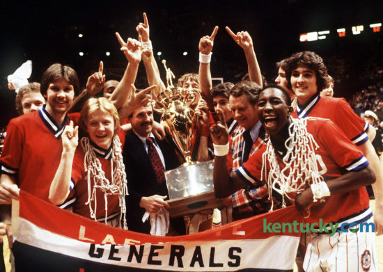 The Lafayette Generals basketball team celebrate after winning the Boys' Sweet 16 championship, March 17, 1979 in Rupp Arena. Dirk Minniefield, who was named Mr. Basketball that year, is front right with the net around his neck. Assistant coach Donnie Harville and head coach Charles “Jock” Sutherland, right, hold the trophy. On Oct. 23, 2016, Sutherland was named to the Kentucky High School Athletic Association 2017 Hall of Fame class, along with 10 others. Photo by Ron Garrison | staff