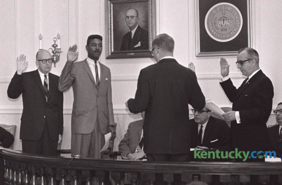 Three Lexington City Commissioners were sworn in by County Judge  Joseph E. Johnson III (back to camera) on January 3, 1966.  The commissioners were from left  Charles Wylie, Harry Sykes and Fred Keller. Sykes, who died in 2012, was LexingtonÕs first African American city commissioner, mayor pro tem and vice mayor. Mayor Jim Gray, with the support of 11th District Councilmember Peggy Henson, has asked members of the Urban County Council to pass a resolution renaming Red Mile Place for Sykes. Herald-Leader Archive Photo