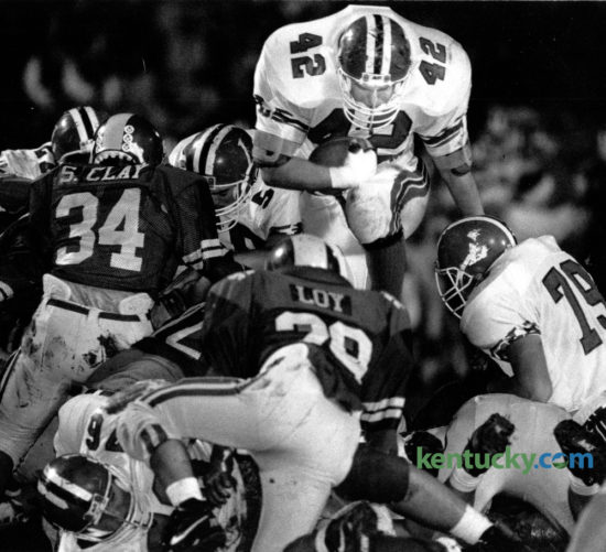 Lafayette's Bert Hooper (42) dove over the Henry Clay line to pick up short yardage during first quarter action on November 1, 1991. Lafayette came out on top with a 24-16 victory at Heber Field. The Generals play Scott County tonight in state semi-final action at Lafayette. Photo by Tim Sharp | Staff