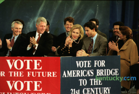 President Bill Clinton and first lady Hillary Clinton talked with Kentucky basketball coach Rick Pitino and his wife Joanne on the speaker's stage at UK November 4, 1996. On Election Eve, Clinton finished months of campaigning with a high-energy pep rally on the UK campus in front of about 14,000 supporters. Kentucky was one of a handful of states where polls showed Clinton running neck and neck with Republican nominee Bob Dole. Clinton won the election with 49.2 percent of the popular vote to Dole's 40.7 and Ross Perot's 8.4. Clinton also carried Kentucky. Photo by Frank Anderson | Staff