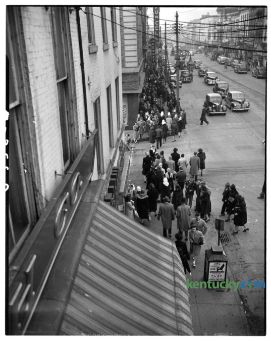 Christmas shoppers along West Main Street with the largest crowd on the sidewalk outside the Purcell Company department store, top left, in December 1945. The Lexington Leader reported "that despite of continuing scarcity of many articles, including toys, Lexington stores have been jammed with shoppers the last several weeks."The photo was taken from a second story window of B.B. Smith and Company clothing store, just east of Mill Street, looking west along Main Street. Published in the Lexington Leader December 18, 1945. Herald-Leader Archive Photo