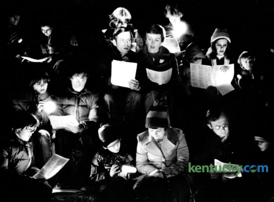 Members of Gethsemane Lutheran Church sang carols during the church's annual Christmas in a Barn service December 20, 1979. The service of prayer, song and communion was held in a barn off Bowman's Mill Road. Flashlights provided the only light for the service. Photo by Ron Garrison | Staff