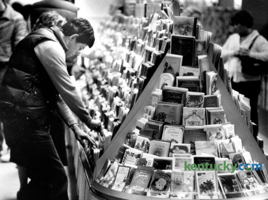 Robert Nave of Lexington was taking his time while trying to pick out a Christmas card at Cards N' Such at Fayette Mall on December 14, 1983. The busiest mailing and shipping day of the year will be tomorrow, Monday December 19. Photo by David Perry | Staff