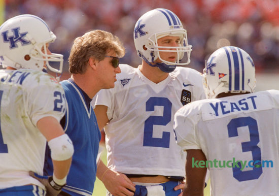Kentucky coach Hal Mumme talked with quarter back Tim Couch (2), and wide receivers Lance Mickelsen (21) and Craig Yeast (3), during their game against  Penn State in the Outback Bowl in Tampa, Fla., Friday January 1, 1999. The Wildcats lost to the Nittany Lions 26-14. Kentucky takes on Georgia Tech today at 11am in the Taxslayer Bowl in Jacksonville, Florida. Photo by Charles Bertram | Staff