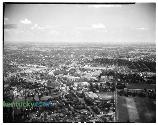 Aerial picture of the University of Kentucky campus during the 1945-46 school year. Downtown Lexington visible in background. South Limestone is seen running diagonally up from the bottom of the photo, while Rose Street moves vertically up the image. In between the two streets on campus is Memorial Hall, and Stoll Field. Directly behind Stoll Field is the future site of Memorial Coliseum, which started to be built shorty after this picture. Further in the background, at about exactly the middle of the image, is downtown Lexington, featuring  Lexington’s first skyscraper, the First National Building. Herald-Leader archive photo