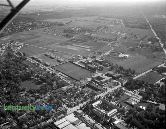 1954 aerial view of the University of Kentucky campus, centered on a men's dormitory, to be named Donovan Hall, being built, center right, facing Rose Lane. It was completed in 1955 and named to honor the service of Herman L. Donovan, president of the University at that time. A livestock exhibition building is also in the process of being built, above and to the right of the dorm. This view of south campus precedes the building of the Medical Center, which would later sit where the open field is farther out Rose Lane closer to the intersection with South Limestone Street, seen at top right. In the upper middle of the image on the farmland is the future site of Commonwealth Satdium and the heavily treed area in the left of the image is now the site of the W.T. Young Library. Published in the Lexington Leader October 6, 1954.  Herald-Leader Archive Photo