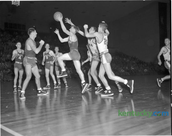 Lafayette High school guard Jimmy Hutchens put up a shot during the Generals Dec. 2, 1950 game against Clark County. The game was a rematch of the previous season's finals of the state basketball tournament, won by Lafayette. This time around Clark County got revenge in front of the 5,000 fans at UK's Memorial Coliseum, winning 55-51. The Cardinals would finish the season winning the school's first state title. In 1963 they were consolidated with Winchester High School and are now known as George Rogers Clark High School. Published Dec. 3, 1950 in the Sunday Herald-Leader
