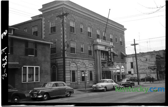 The Harrison Hotel on dowtown Cynthiana's Main Street, January, 1951. Note the building advertises that it is air conditioned and has a coffee shop and dairy bar inside. Next to the building on East Pleasant Street was a Standard Oil gas station. The photo went with a standing feature on different communities in Central Kentucky. The story highlighted the addition of industries and a growing hospital as signs of civic growth in the city of about 4,800. Residents also cited progressive civic organizations as evidence that they live in the "finest town on earth". Today the building is the Harrison House Apartments. Herald-Leader Archive Photo