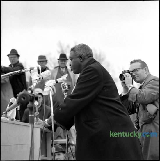 Former Brooklyn Dodgers ballplayer Jackie Robinson addressed a crowd of 10,000 at a civil rights rally at the state capitol in Frankfort, March 5, 1964. Dr. Martin Luther King Jr. and other civil rights leaders led the peaceful demonstration, calling for a “good public accommodations bill” to prohibit segregation and discrimination in stores, restaurants, theaters and businesses. At right is photographer Bill Strode, who was on assignment for the Louisville Courier Journal. Herald-Leader Archive photo