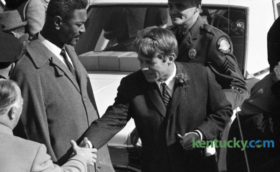 Sen. Robert F. Kennedy, center, shook hands with Governor A.B. Happy Chandler after arriving at Lexington's Blue Grass Field, Feb 13, 1968, before beginning a two-day tour of poverty areas in Eastern Kentucky. At left is Harry Sikes, Lexington's first black city commissioner. Lexington's Red Mile Place, off Versailles Road, was recently renamed to Harry Sykes Way in honor of the former mayor pro tem and vice mayor. Click here to see an image of Sykes being sworn in as a city commissioner. Herald-Leader Archive Photo