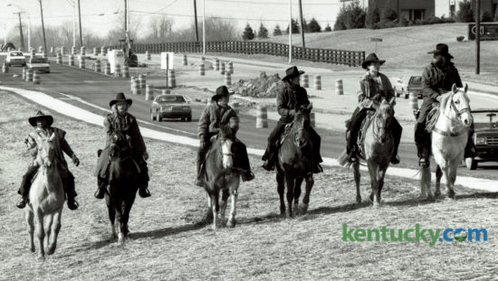Six riders on horseback started out from Humana Hospital on a 1450 mile ride across Kentucky to raise money for the Kentucky Diabetes Foundation Patient Assistance Program on February 24, 1988. The riders, from left, Kenneth Carter, Ray Crowe, David Napier, Allen Reynolds, Dennis Adams and Billy Adams, rode along Man O'War Blvd toward Winchester Road. Photo by John C. Wyatt | Staff