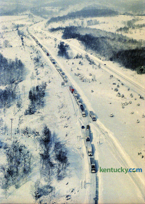 One of the worst snowstorms in 16 years stunned Kentucky Jan. 18, 1994, closing virtually every main road and airport, causing hundreds of accidents and bringing sub-zero temperatures. Snow depths ranged from 3 inches in southwestern Kentucky to 25 inches in Robertson County, the hardest hit spot in the state. Lexington had 10.2 inches. Louisville had 15.9 inches. Gov. Brereton Jones declared a state of emergency and closed all of the interstates — I-75, I-71, I-64, I-65 and I-24 — and the Blue Grass Parkway. Police, however, were too understaffed to enforce the closures. Most county and state roads were blocked because of accidents or closed by local officials, state police said. Jackknifed tractor-trailers littered the highways. Hundreds of motorists were stranded. There was little room for rescue workers to get through to help them. Shown here, southbound traffic on I-75 was frozen in its tracks near the Corinth exit south of Dry Ridge after the interstate was shut down. Grant County Department of Emergency Services coordinator Rick Willoby said crews can't clear the roads until those trucks are moved, and it's been difficult to find enough equipment to tow tractor-trailers out of the way. In Lexington the high was 4 degrees and the low was -9, breaking a a 64-year-old record by three degrees for the date. City workers spent most of yesterday clearing roads and towing more than 100 cars from the main arteries. Photo by Charles Bertram | staff