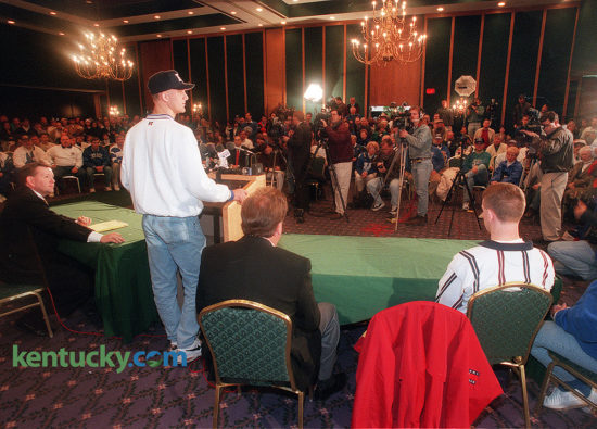 High school football standout Tim Couch announced his intentions to sign a letter-of-intent to play football at the University of Kentucky, Dec. 24, 1995. About 200 fans attended the news conference in a ballroom at the downtown Lexington Radisson Hotel, ninety minutes before the tip-off the annual Kentucky-Louisville basketball game across the street at Rupp Arena. "I came up to watch the basketball game, but I would have come up just to see this," said fan Eddie Evans, 49, of Corbin. After considering Auburn, Florida, Florida State, Notre Dame, Penn State and Ohio State, among others, Couch narrowed his list to UK and Tennessee. The Tennessee spin was that Couch could play a year behind star Vols quarterback Peyton Manning, then step in as a starter in 1997 when Manning turned pro. "I didn't want to just be another name in a great line of quarterbacks at a school, I wanted to start my own name here at Kentucky and hopefully get a big tradition started here," Couch said. Rated the nation's best quarterback prospect by most recruiting services, and possibly the best Kentucky football prospect since Paul Hornung left Louisville Flaget for Notre Dame in the 1950s, Couch threw for a national record 12,104 yards and 133 touchdowns over his four years. During his senior year, the 6-foot-5, 215-pounder threw for 3,916 yards and 42 touchdowns, leading Leslie County to 12-2 record. He was named Gatorade's national high school player of the year. "This is the best day of my life," said Tim's father, Elbert. "This is where we wanted him to go all along." Photo by Mark Cornelison | staff