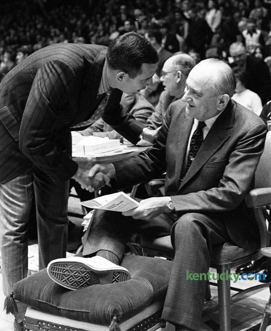 University of Kentucky basketball coach Adolph Rupp is greeted by Alabama coach and former Wildcat player C.M. Newton, Feb. 22, 1971 at Memorial Coliseum. Rupp, 69, was sidelined for the game with a foot infection complicated by by diabetes. He had been hospitalized at the UK Medical Center since Feb. 8, but commuted to UK home games and some practices. Rupp missed three games, viewed three other ones as a spectator and even made a road trip to Vanderbilt. Assistant coach Joe B. Hall was named active coach during Rupp's absence. Newton was a member of UK's 1951 national championship team under Rupp. Newton coached at Lexington's Transylvania University for 12 years before being named coach at Alabama, a job he got in part because of a recommendation by Rupp. Newton went on to lead the Tide to three straight SEC titles. After a 30-year coaching career, he came back to Lexington in 1989 to be the athletic director at his alma mater, UK, where he served for 11 years. Herald-Leader staff file photo