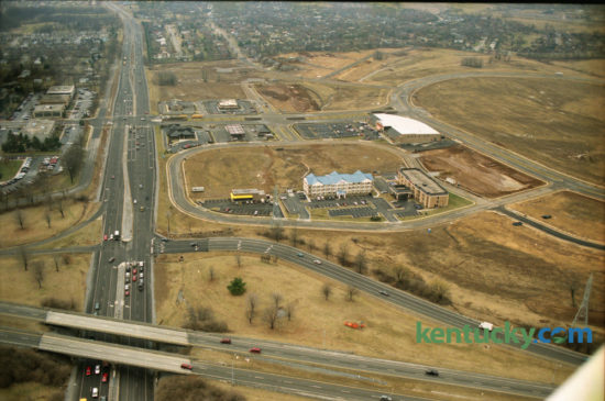 Aerial photo of Beaumont Centre under construction on February 20, 1996. New Circle Road is seen running left to right at the bottom of the photo and intersects with Harrodsburg Road at lower left.